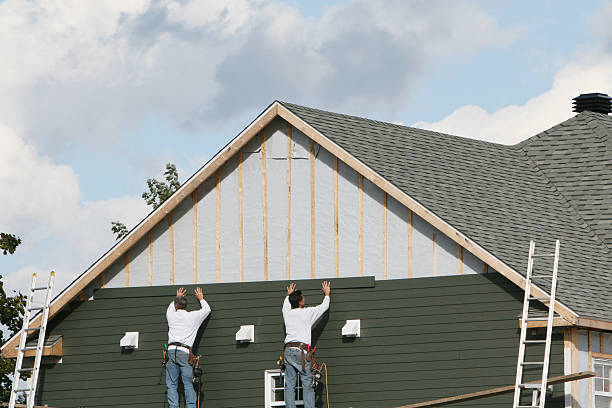 Professional Siding Installation technician working in Boulder, CO